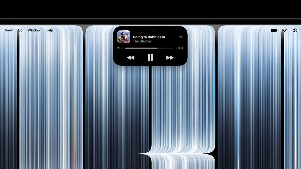 نمای نزدیک داینامیک آیلند مک‌بوک پرو هنگام پخش موسیقی در Apple Music